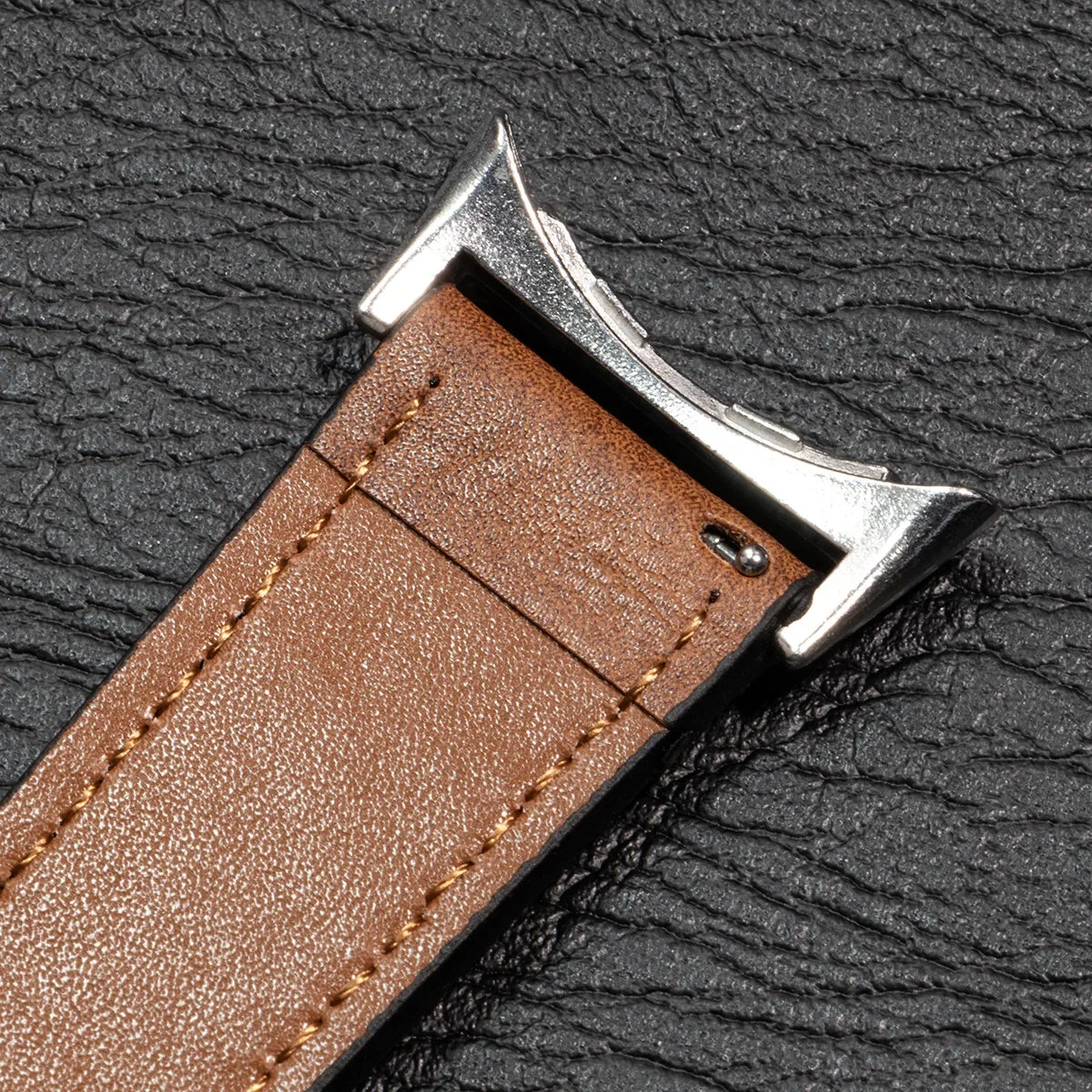 Leather strap stitching and metal connector detail