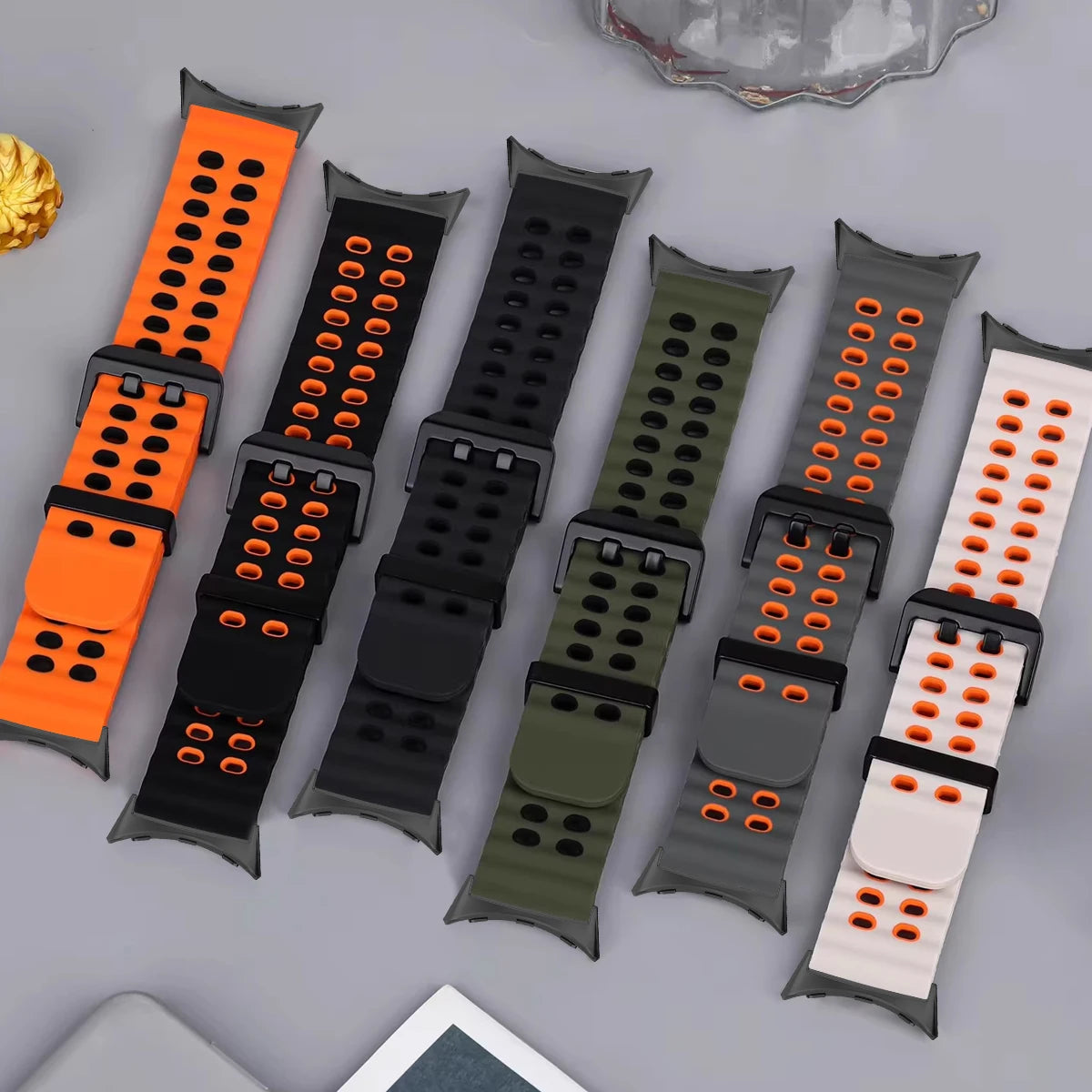 Six perforated silicone straps laid flat