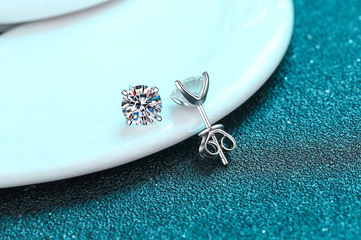Four-Prong Moissanite Solitaire Stud Earrings in Silver — Front and side views