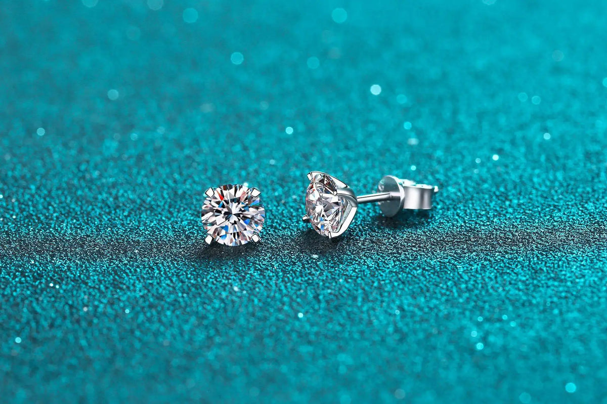 Four-Prong Moissanite Solitaire Stud Earrings in Silver — Round studs on turquoise