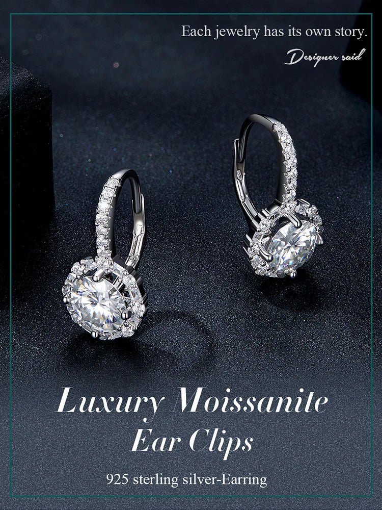 Round Halo Moissanite Leverback Earrings in Silver — Pair on dark surface