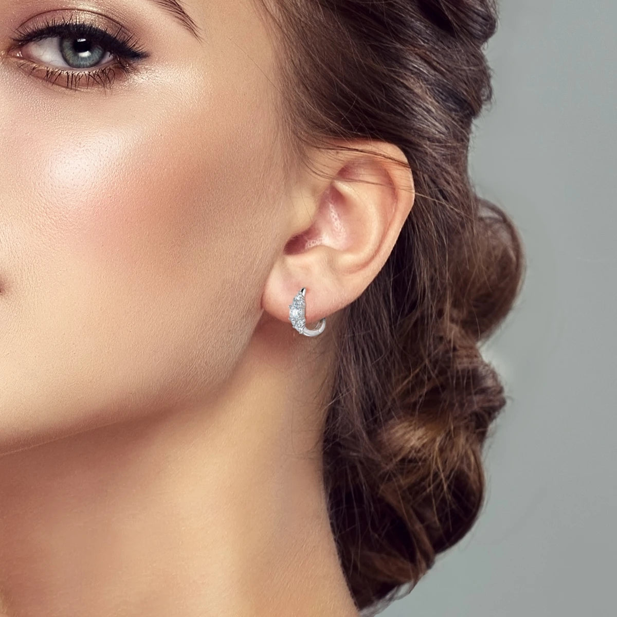 Moissanite Graduated Cluster Hoop Earrings in Sterling Silver — Cluster hoop worn on ear — BandsCo Straps