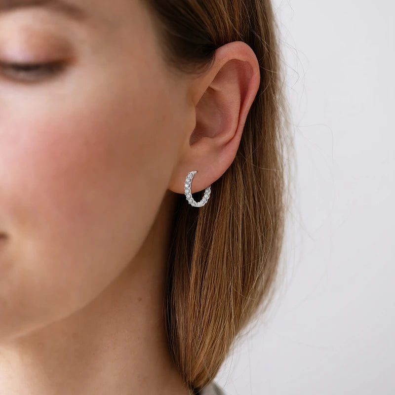 Moissanite Inside-Out Hoop Earrings in 925 Sterling Silver — Shown on ear