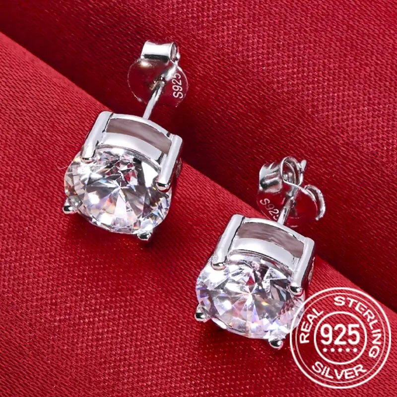 Round Four-Prong Moissanite Stud Earrings in Sterling Silver — Setting detail