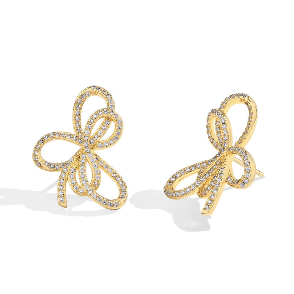 Open Bow Moissanite Stud Earrings in 925 Sterling Silver — Gold-tone bow pair