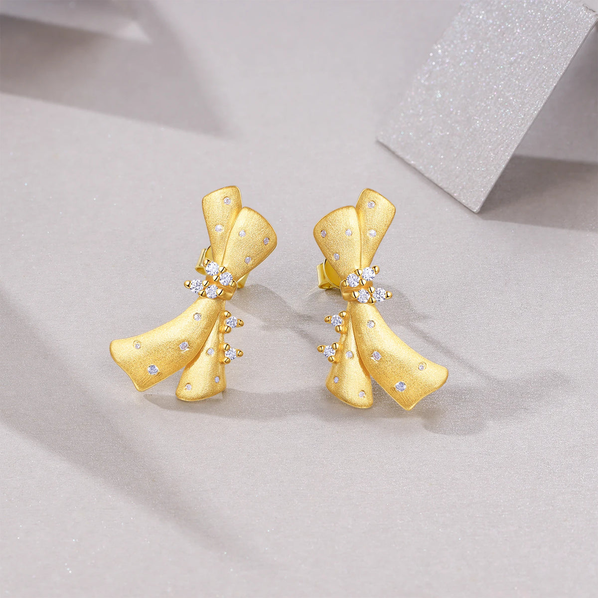 Gold-Plated Moissanite Ribbon Bow Stud Earrings — Gold ribbon bow pair — BandsCo Straps