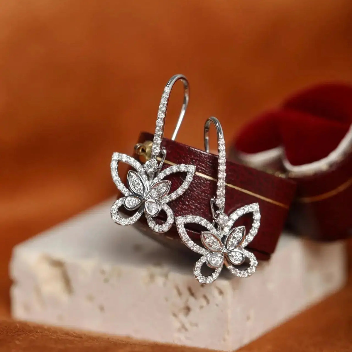 Openwork Butterfly Moissanite Drop Earrings in Silver — Angled butterfly drops