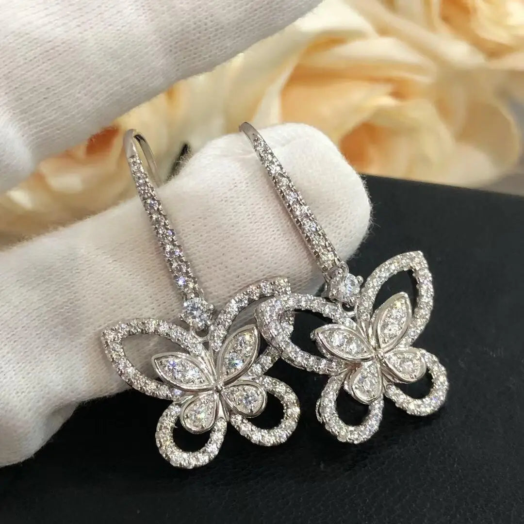 Openwork Butterfly Moissanite Drop Earrings in Silver — Butterfly pair on display