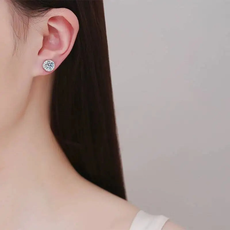 Round Halo Moissanite Non-Pierced Earrings in Silver — Worn on ear