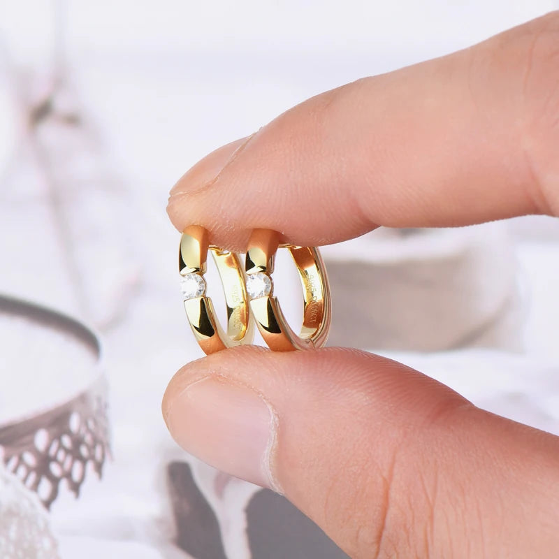 Minimalist Moissanite Hoop Earrings in Sterling Silver — Gold-Tone pair held for scale