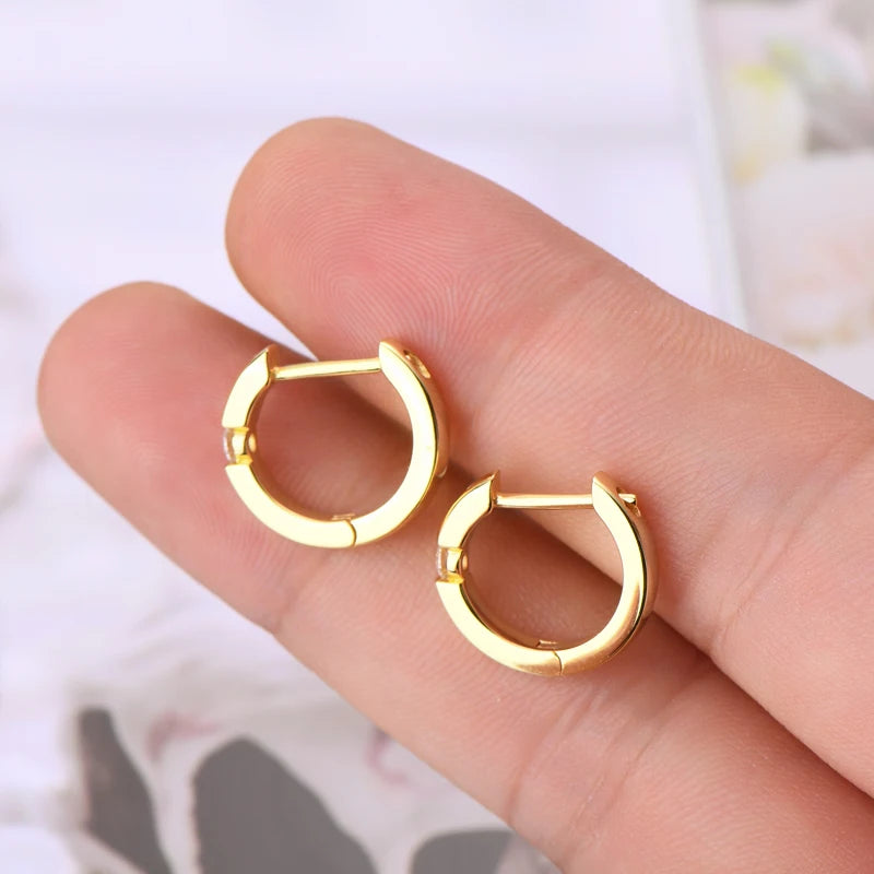 Minimalist Moissanite Hoop Earrings in Sterling Silver — Gold-Tone pair held for scale