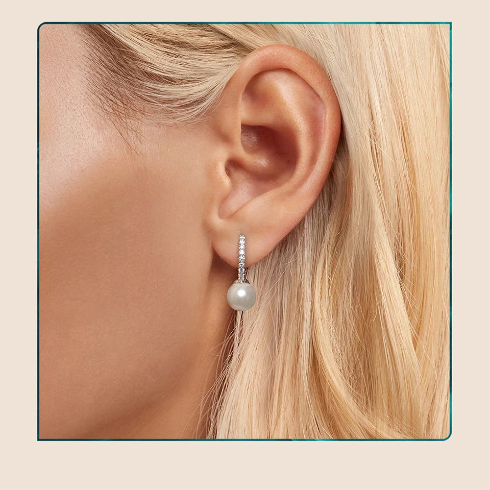 Moissanite Shell Pearl Drop Hoop Earrings in Sterling Silver — Pearl hoop worn on ear — BandsCo Straps