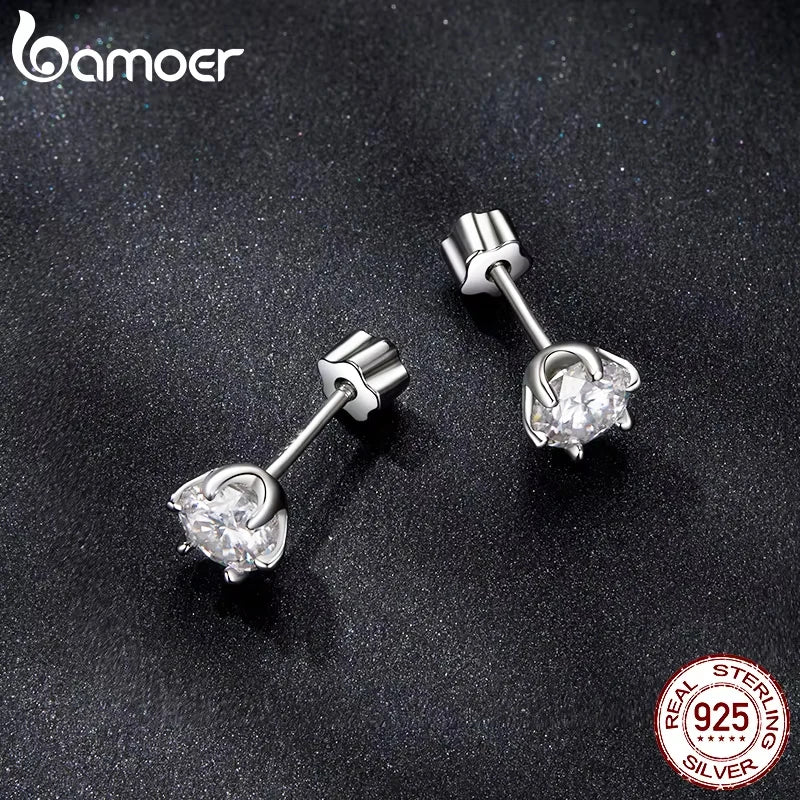 Round Moissanite Crown-Setting Stud Earrings in Sterling Silver — Angled pair