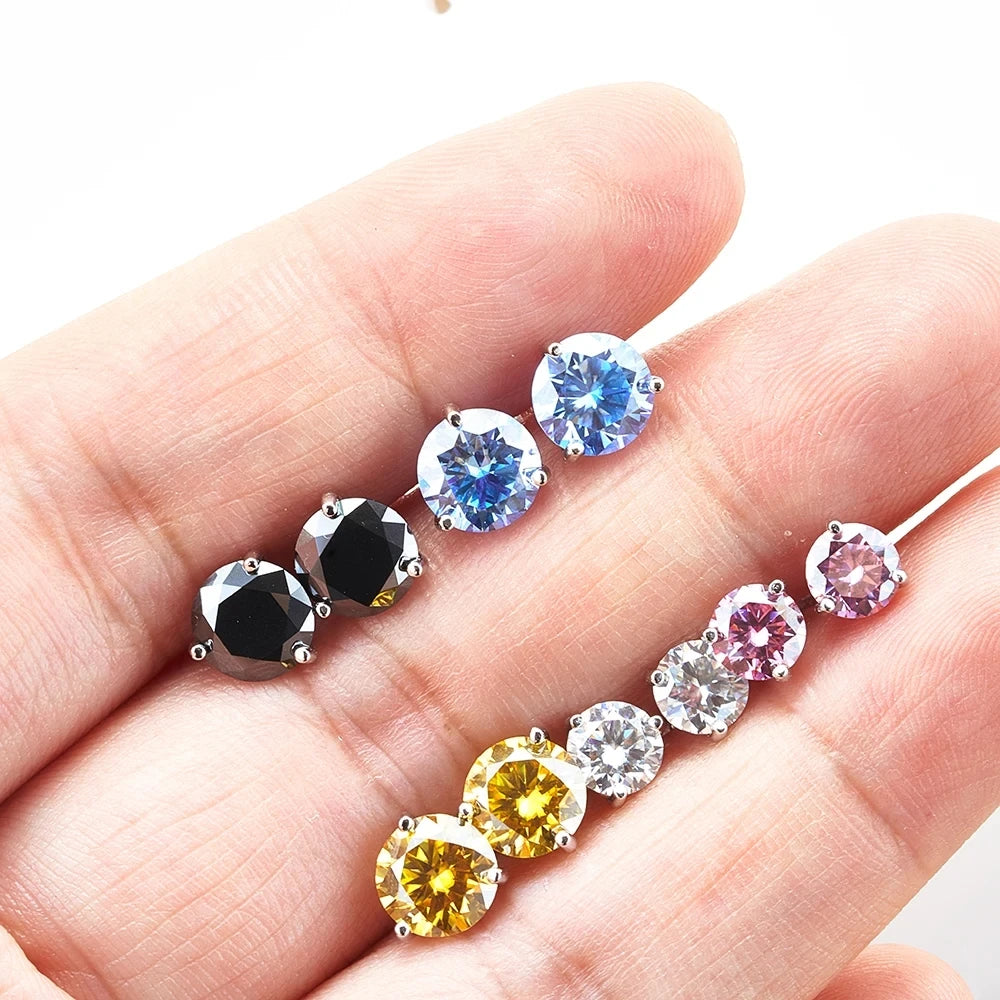 Colored Three-Prong Moissanite Stud Earrings in Sterling Silver — Color comparison on hand