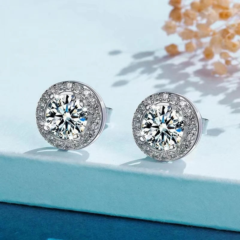 Round Halo Moissanite Stud Earrings in Sterling Silver — Halo studs on display