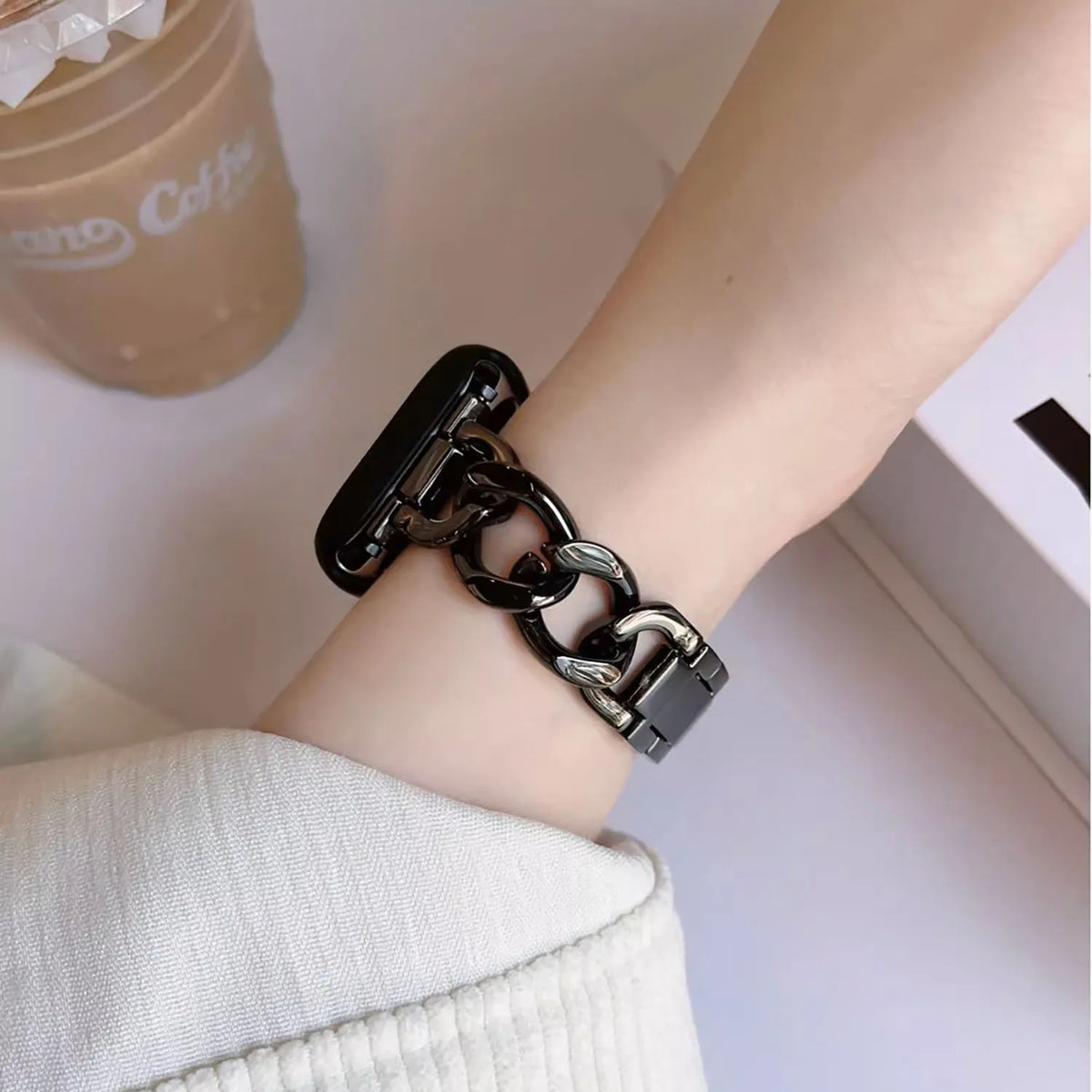Black chain bracelet band worn on a wrist