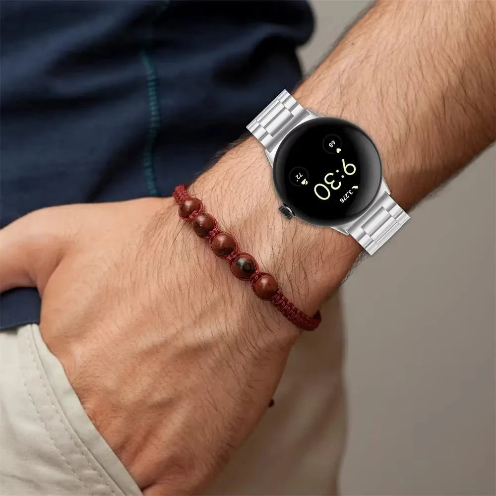 Silver steel Pixel Watch bracelet worn on wrist