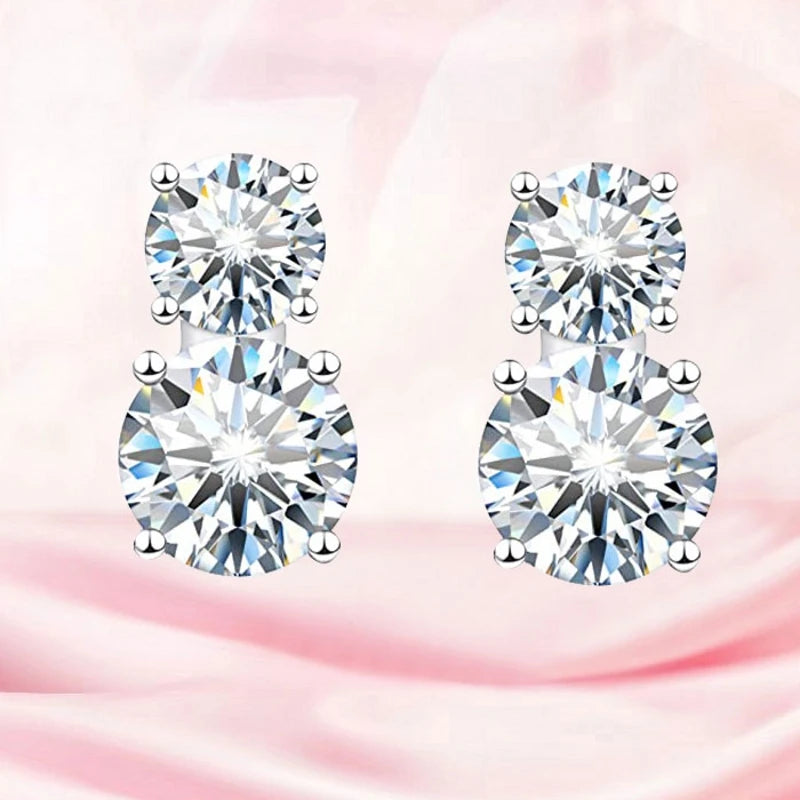 Graduated Two-Stone Moissanite Stud Earrings in Sterling Silver — Two graduated round stones per stud