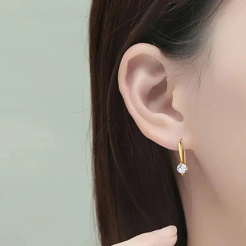Round Moissanite Long-Hook Drop Earrings in Sterling Silver - Drop earrings shown on model