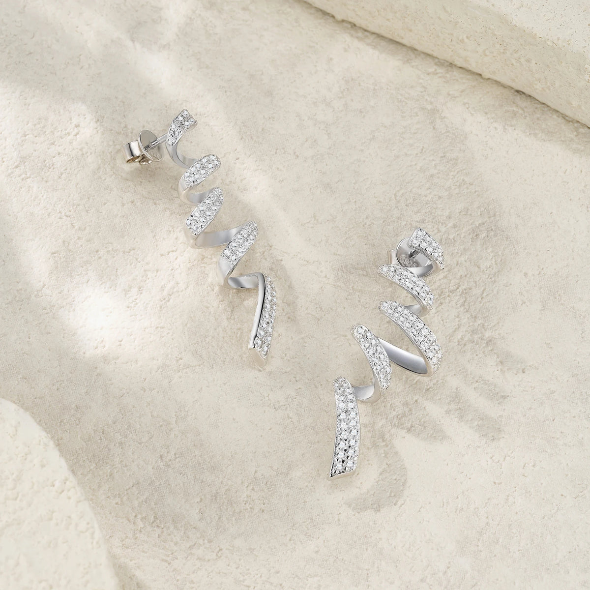 Twisted Spiral Moissanite Drop Earrings in Sterling Silver — Spiral curves on display