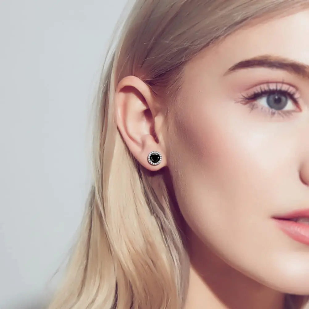 Black Halo Moissanite Stud Earrings in 925 Sterling Silver — Shown on ear