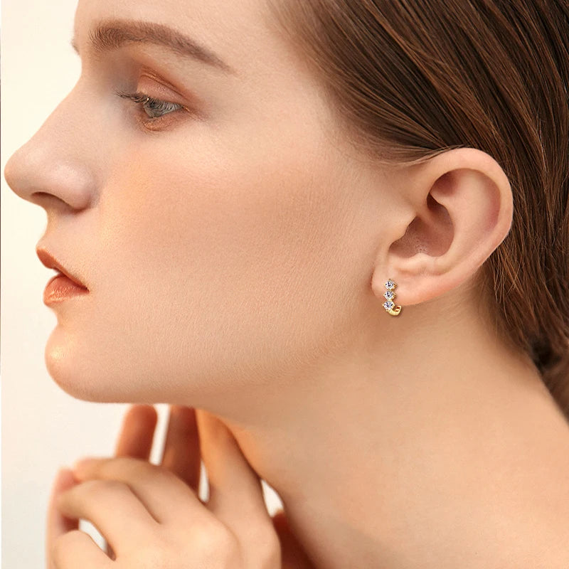 Three-Stone Moissanite Leverback Hoops in Sterling Silver — Worn view