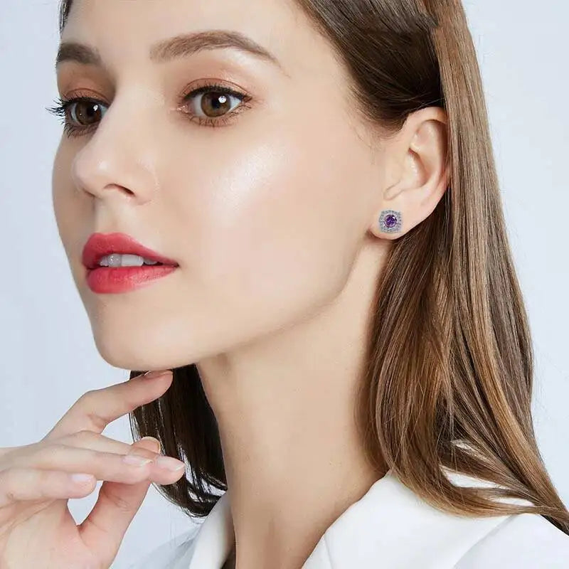 Moissanite Cushion Halo Stud Earrings in Sterling Silver — Purple studs worn on ear — BandsCo Straps