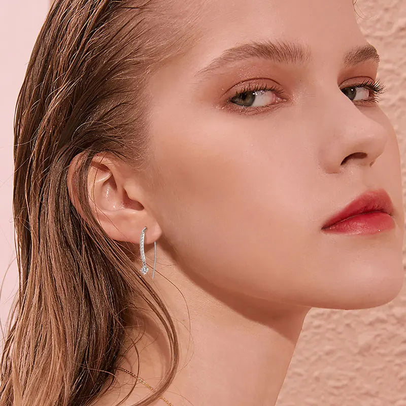 Moissanite Curved Threader Drop Earrings in Sterling Silver — Shown on ear